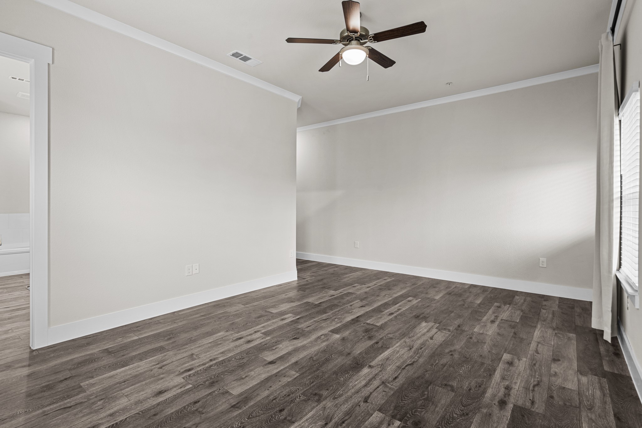 865 Limmer Loop, Unit 1014 Hutto, TX 78634 - Photo 30 of 37 a view of empty room with wooden floor