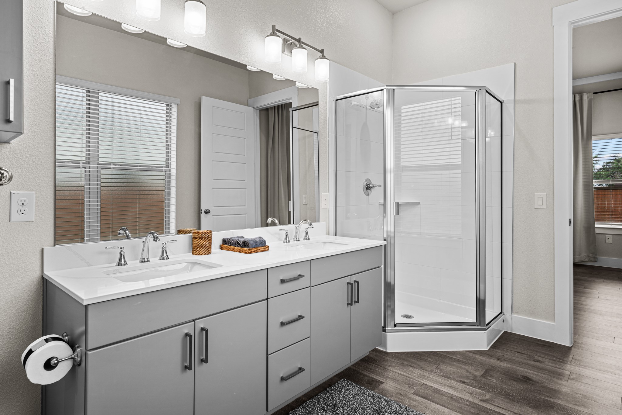 865 Limmer Loop, Unit 1014 Hutto, TX 78634 - Photo 32 of 37 a bathroom with a double vanity sink mirror and double