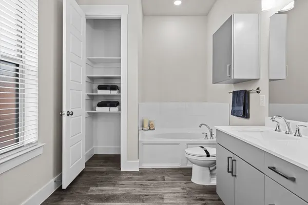 a bathroom with a toilet a sink and a bathtub