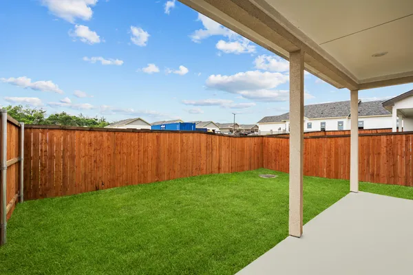 a view of a backyard with a lake view