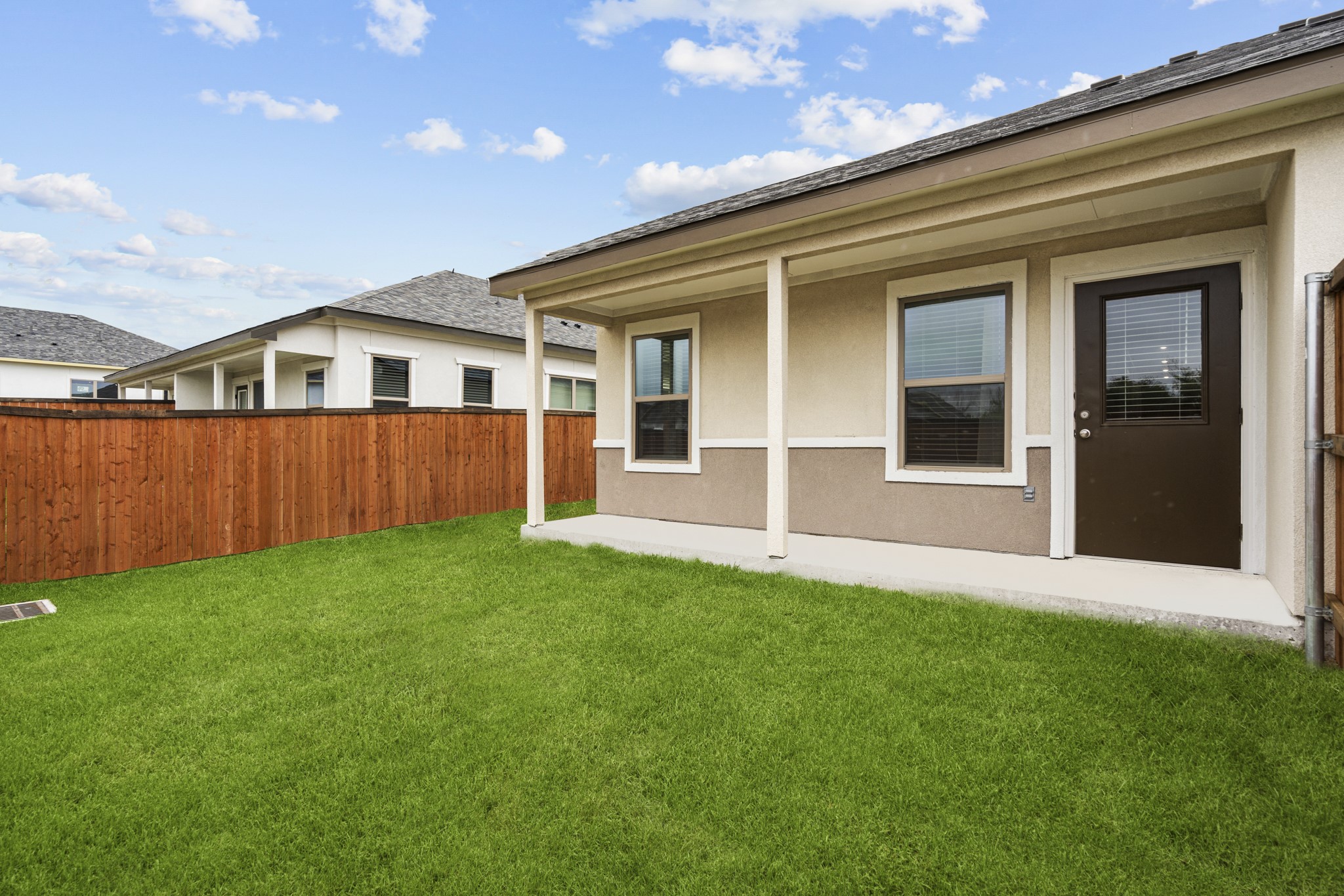 865 Limmer Loop, Unit 1014 Hutto, TX 78634 - Photo 35 of 37 front view of a house with a yard