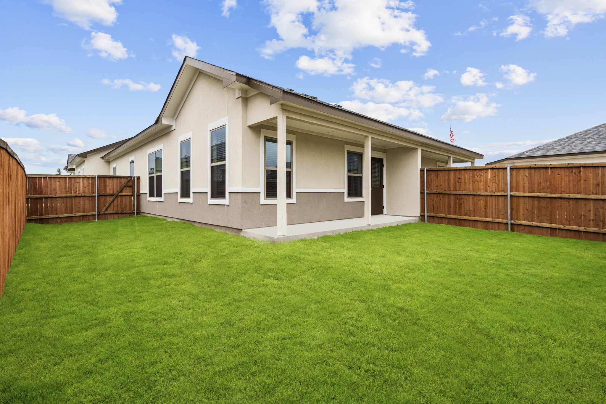 865 Limmer Loop, Unit 1014 Hutto, TX 78634 - Photo 36 of 37 a front view of a house with a garden and yard