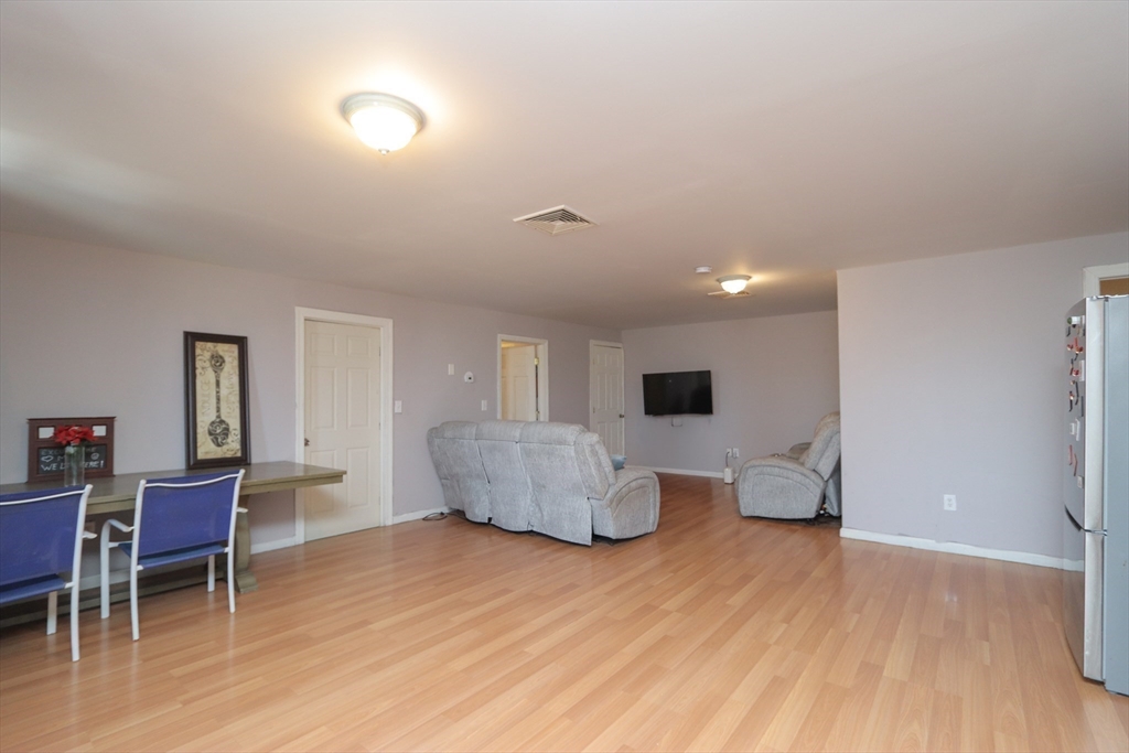 205 Elm Street Westfield, MA 01085 - Photo 13 of 24 a living room with furniture and a wooden floor