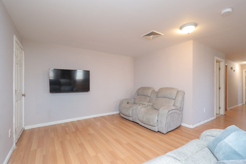 205 Elm Street Westfield, MA 01085 - Photo 14 of 24 a living room with furniture and a flat screen tv