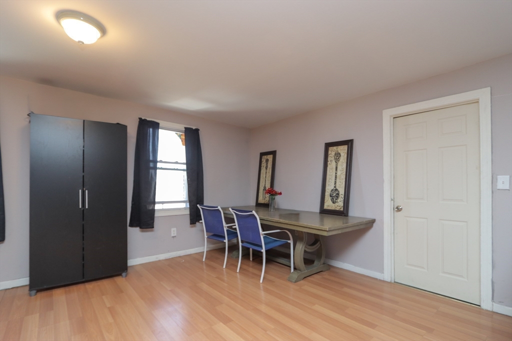 205 Elm Street Westfield, MA 01085 - Photo 16 of 24 a view of a dining room with furniture and wooden floor