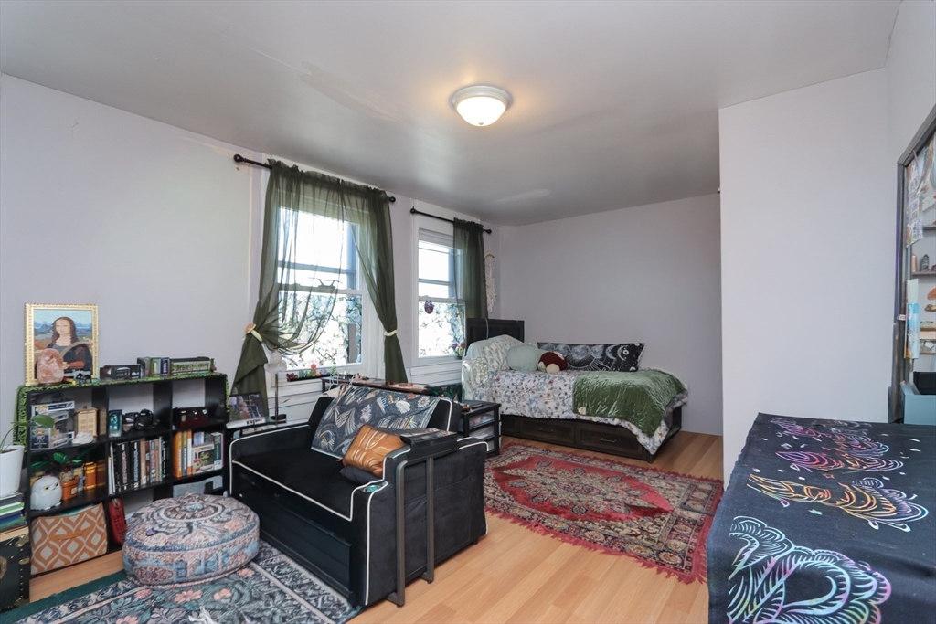 205 Elm Street Westfield, MA 01085 - Photo 17 of 24 a living room with furniture and a large window