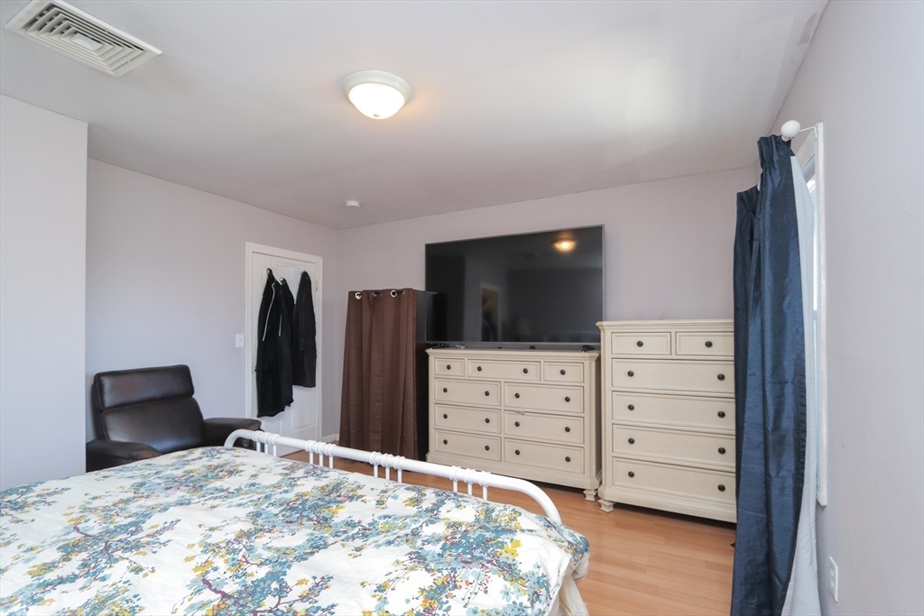 205 Elm Street Westfield, MA 01085 - Photo 21 of 24 a bedroom with a bed and television