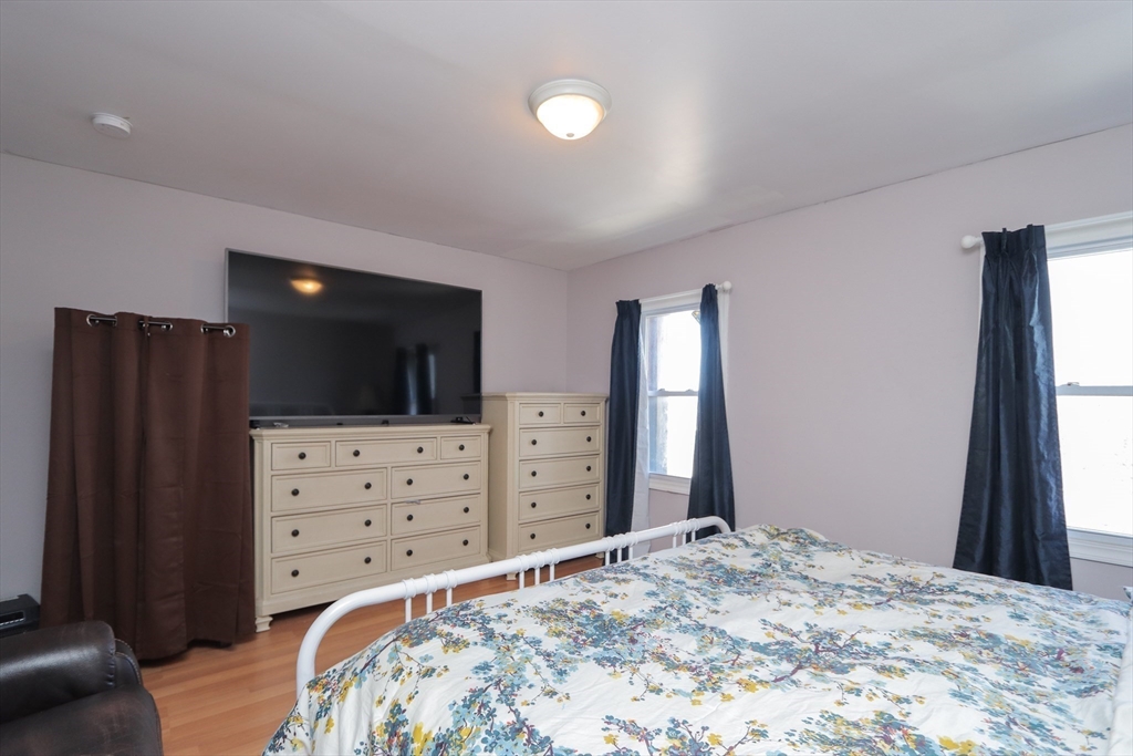 205 Elm Street Westfield, MA 01085 - Photo 22 of 24 a bed room with a bed and a television