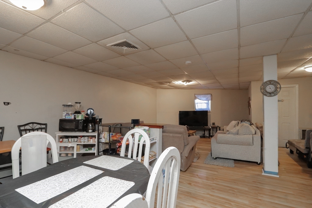 205 Elm Street Westfield, MA 01085 - Photo 10 of 24 a living room with furniture and a flat screen tv