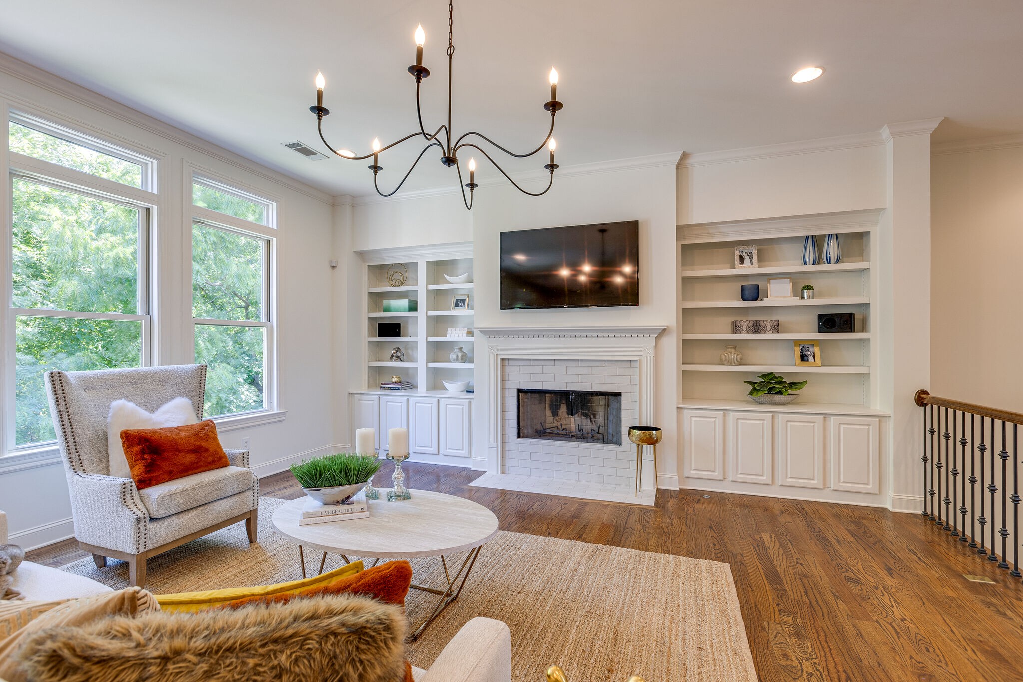 1327 Cottingham Drive Franklin, TN 37067 - Photo 12 of 70 a living room with furniture a fireplace and a flat screen tv