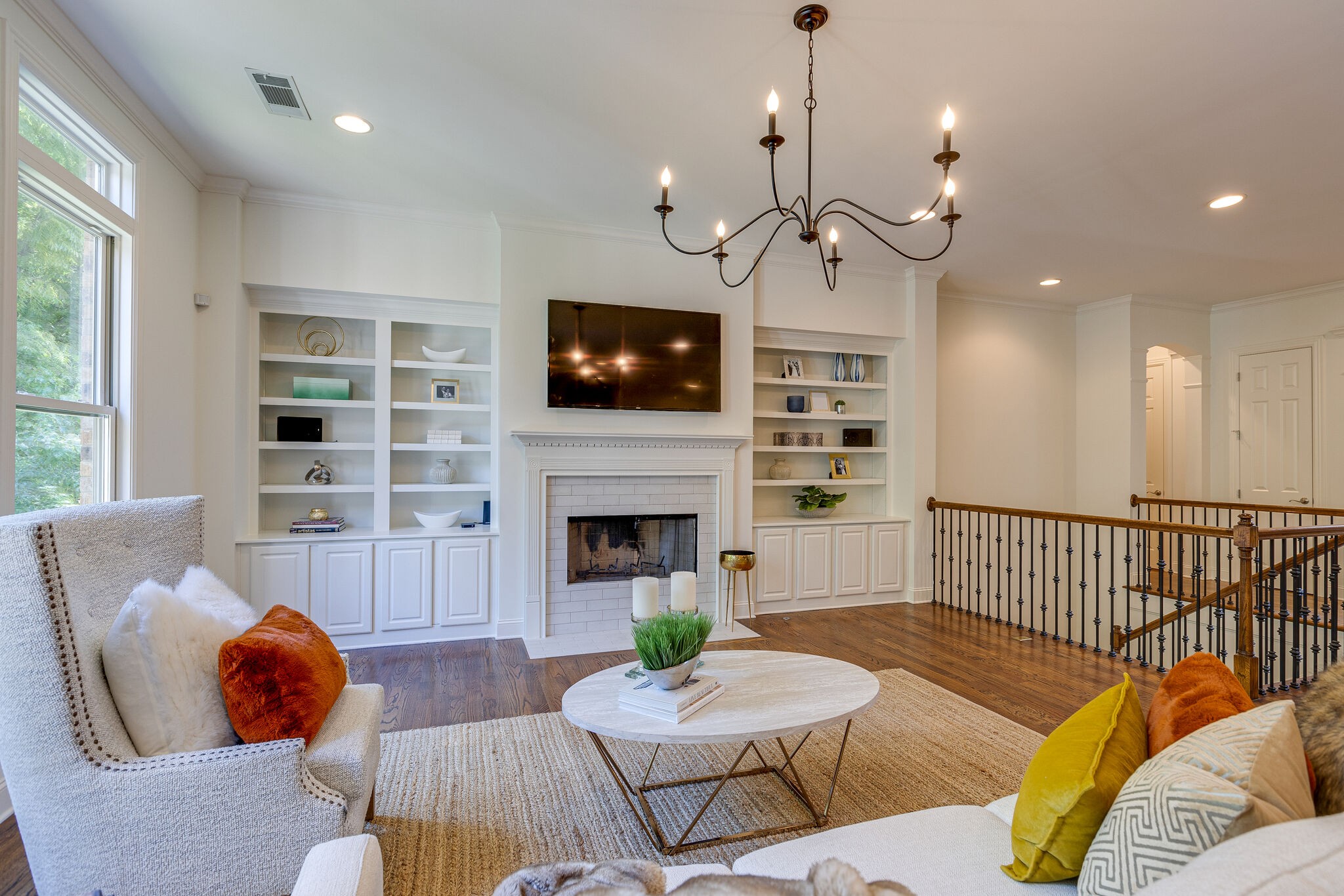 1327 Cottingham Drive Franklin, TN 37067 - Photo 13 of 70 a living room with furniture a fireplace and a flat screen tv
