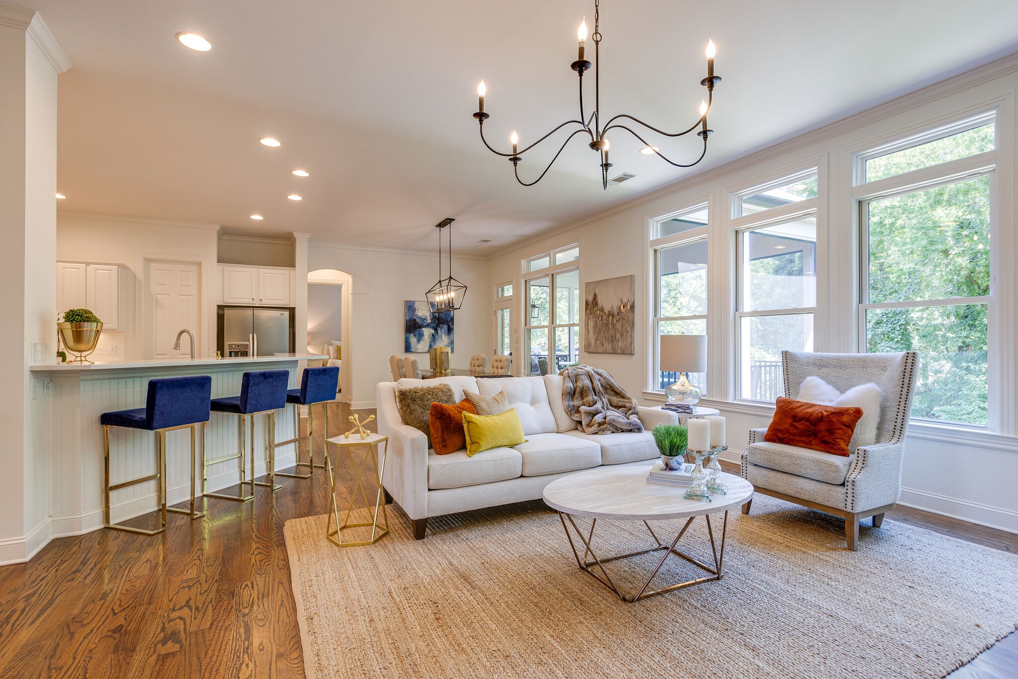 1327 Cottingham Drive Franklin, TN 37067 - Photo 15 of 70 a living room with furniture a rug and a chandelier