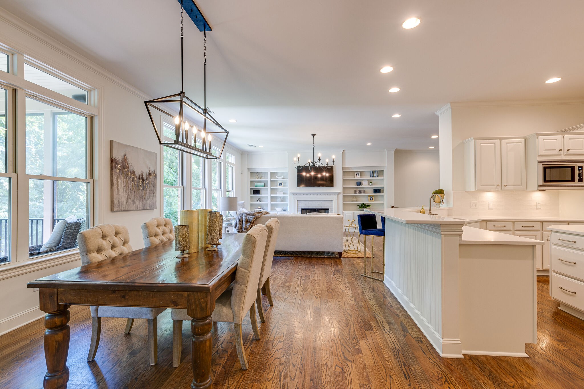 1327 Cottingham Drive Franklin, TN 37067 - Photo 19 of 70 a kitchen with stainless steel appliances kitchen island granite countertop a table chairs and a refrigerator