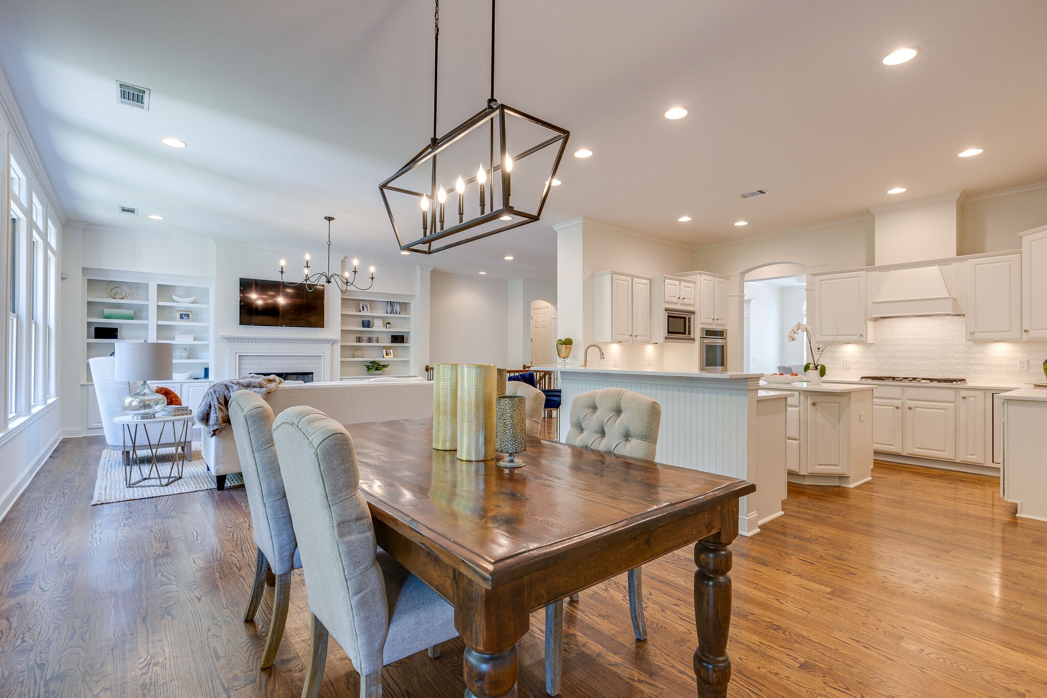1327 Cottingham Drive Franklin, TN 37067 - Photo 20 of 70 a kitchen with stainless steel appliances granite countertop a dining table chairs refrigerator and microwave