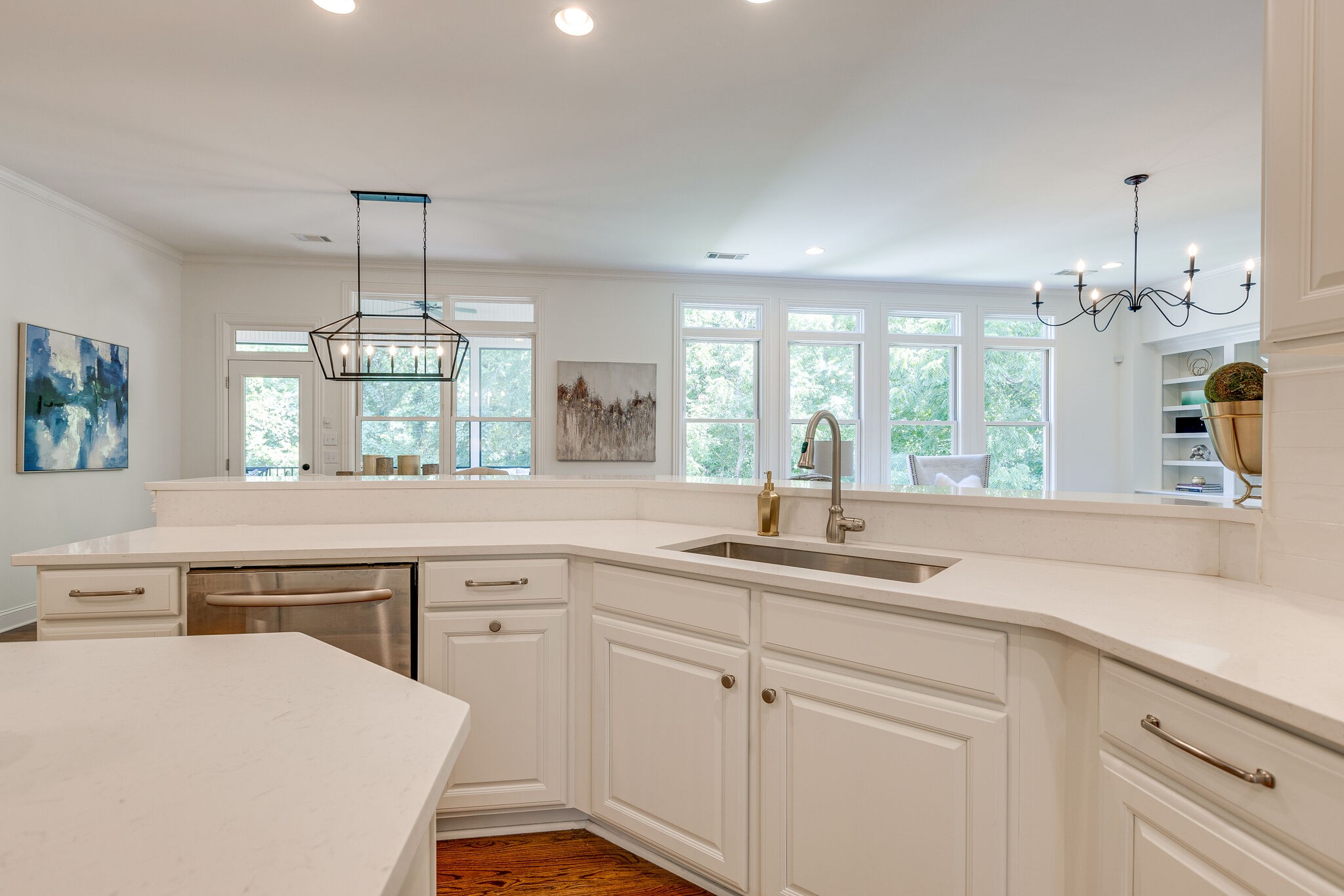1327 Cottingham Drive Franklin, TN 37067 - Photo 26 of 70 a kitchen with a sink dishwasher a stove and white cabinets with wooden floor