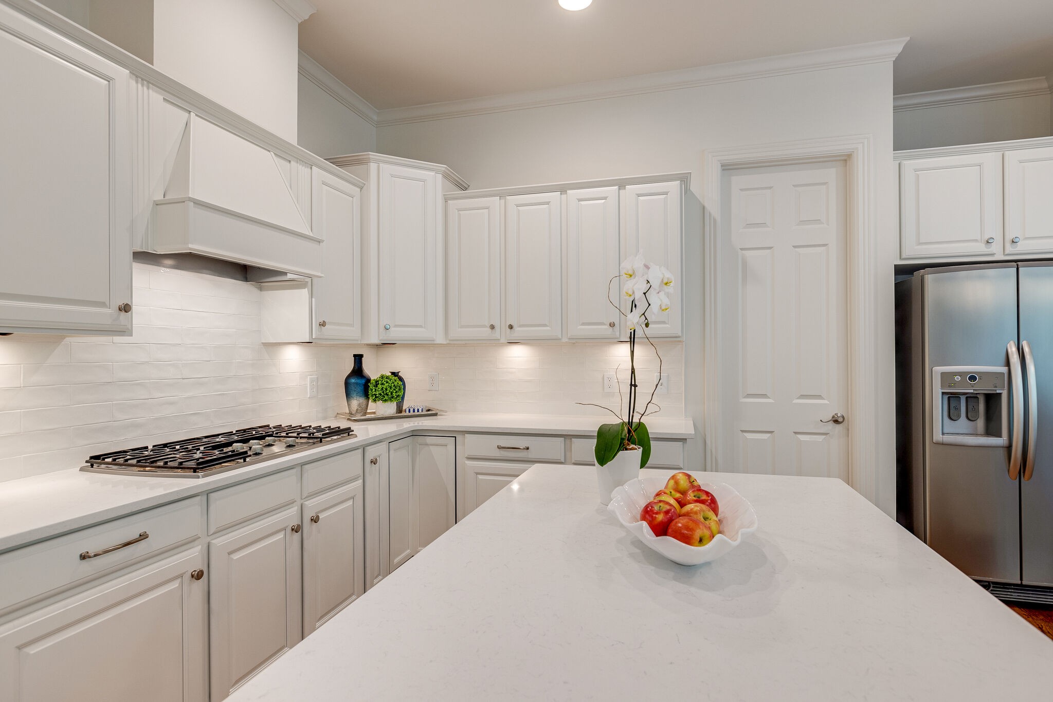 1327 Cottingham Drive Franklin, TN 37067 - Photo 27 of 70 a kitchen with stainless steel appliances granite countertop a sink a stove and refrigerator