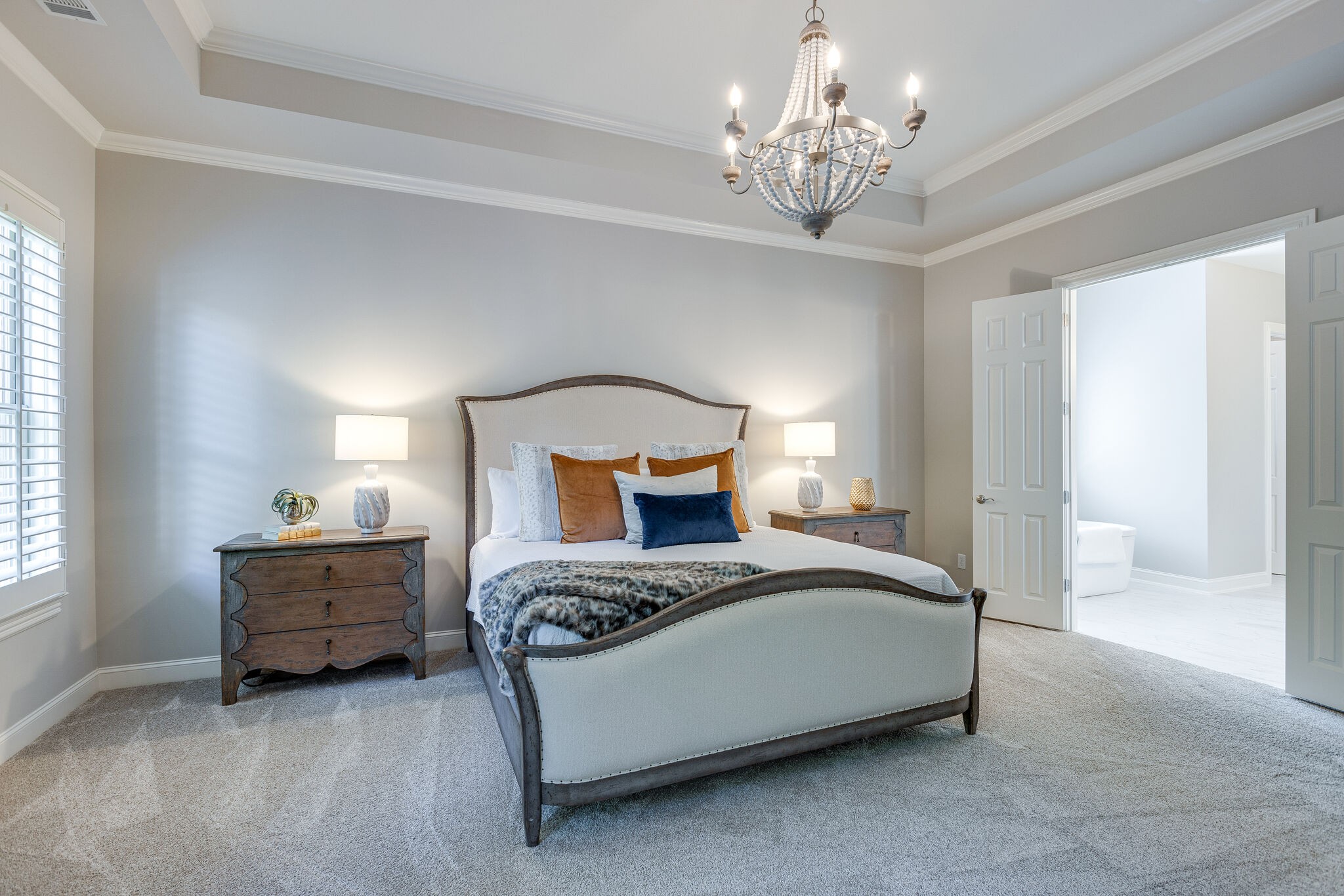 1327 Cottingham Drive Franklin, TN 37067 - Photo 32 of 70 a bedroom with a bed and a chandelier