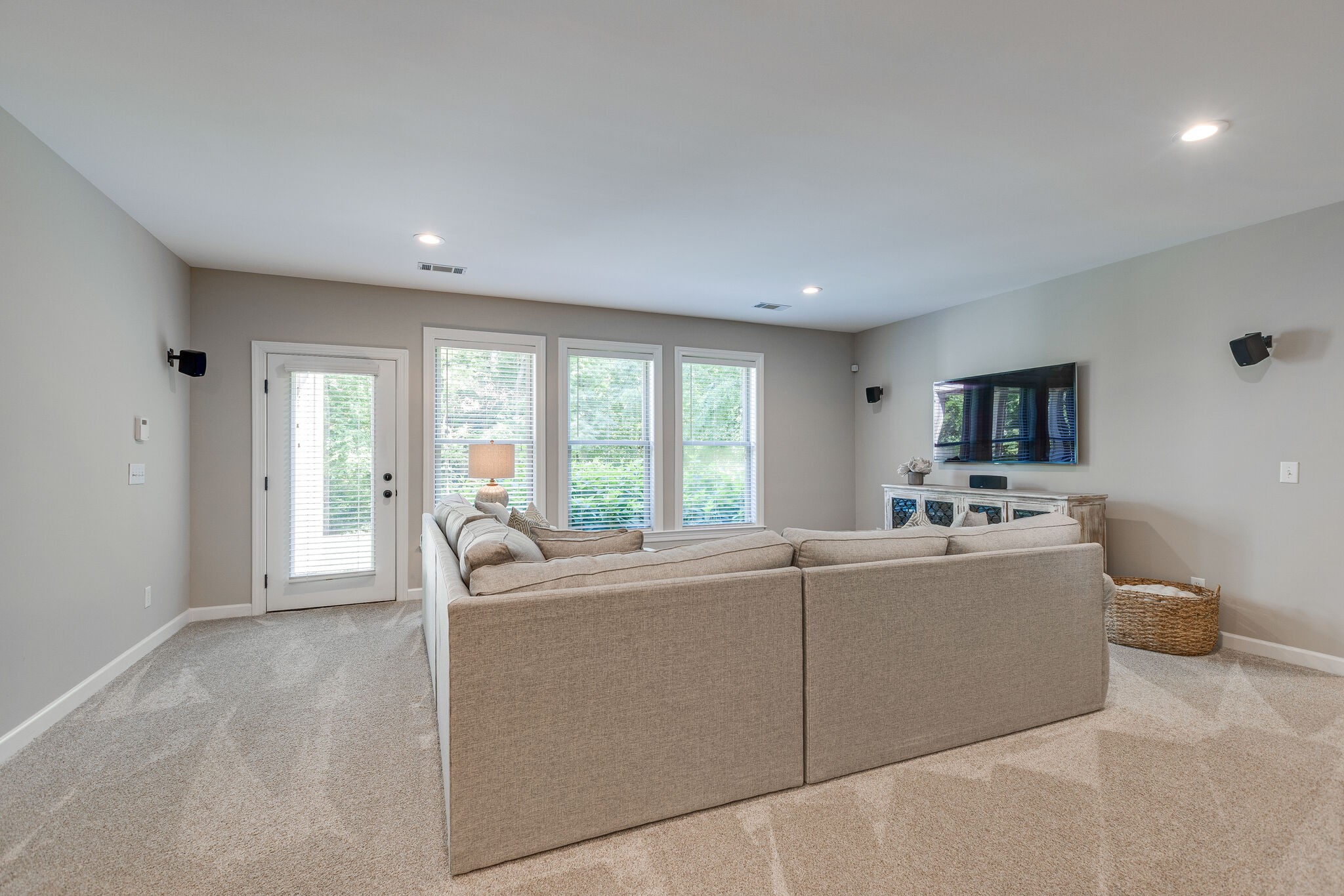 1327 Cottingham Drive Franklin, TN 37067 - Photo 45 of 70 a living room with furniture a flat screen tv and a large window