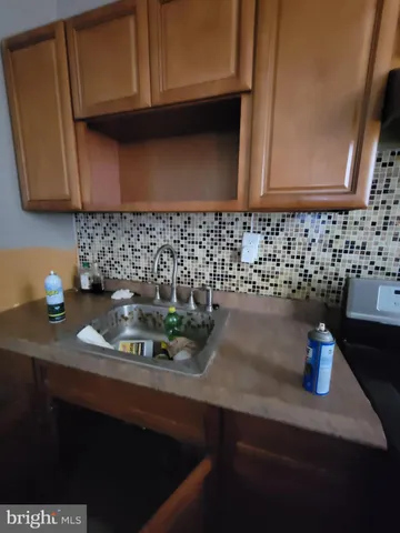 a view of a backyard with plants and a patio