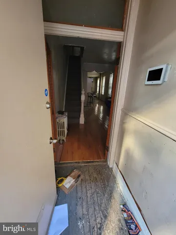 a view of staircase with wooden floor