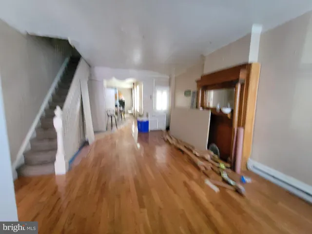 a room with wooden floor and chair