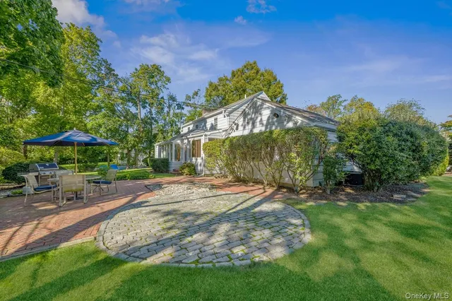 a view of a backyard with sitting area