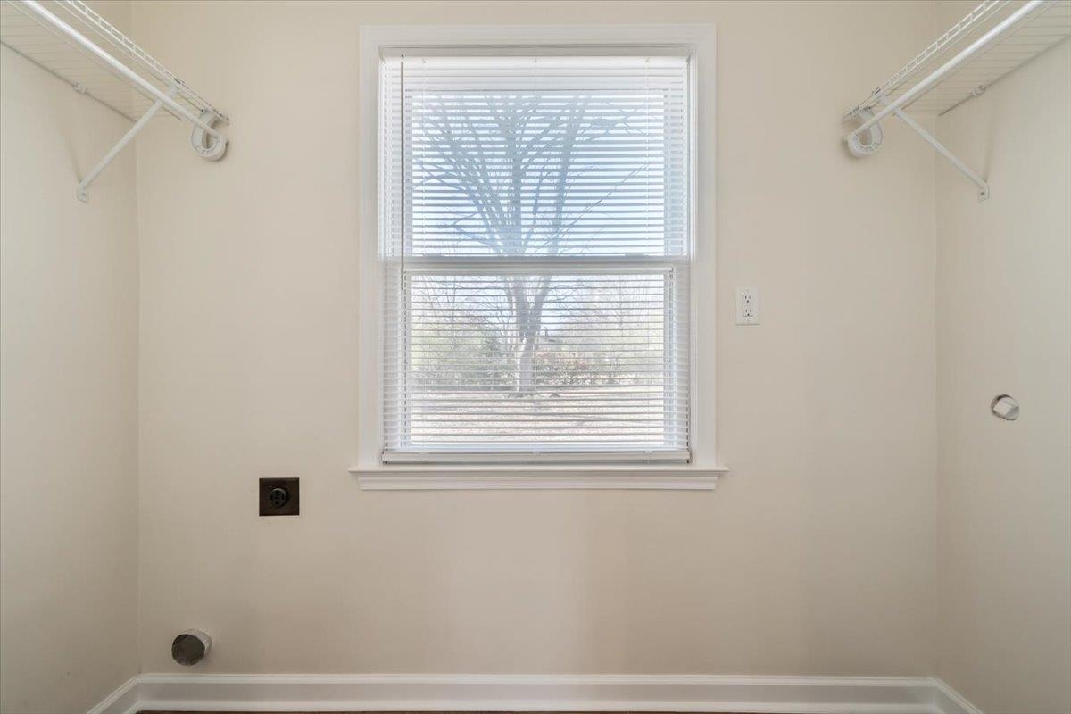 753 Ivy Road Memphis, TN 38117 - Photo 12 of 25 a bathroom with a window and a shower