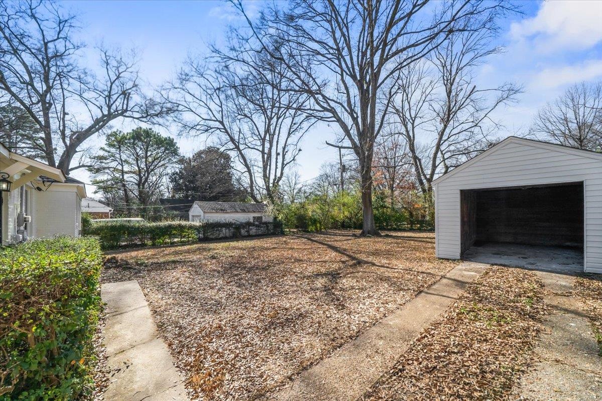 753 Ivy Road Memphis, TN 38117 - Photo 20 of 25 a view of a yard with a house and a trees