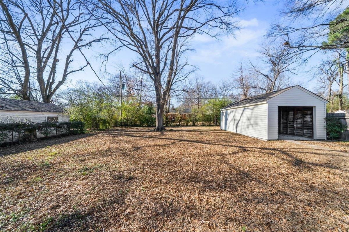 753 Ivy Road Memphis, TN 38117 - Photo 21 of 25 a view of a yard with a house and a tree