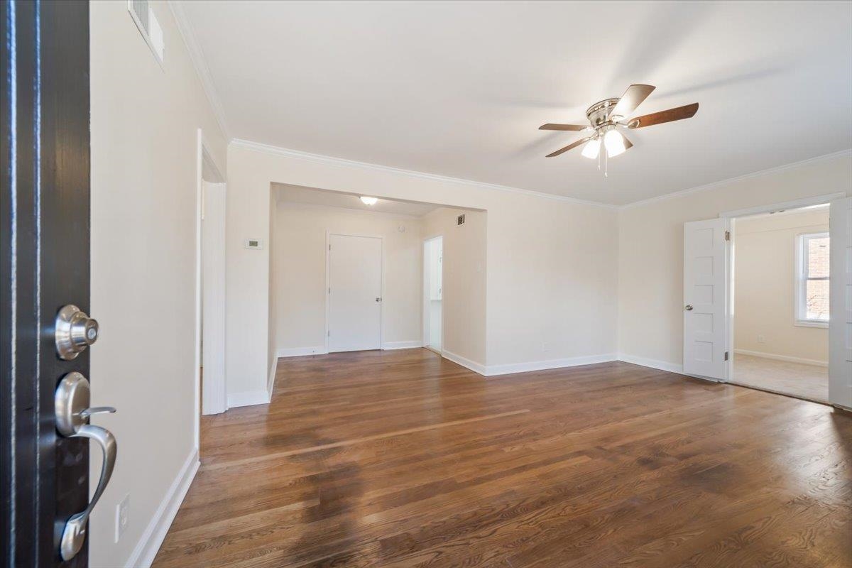 753 Ivy Road Memphis, TN 38117 - Photo 23 of 25 Foyer featuring crown molding, wood finished floors, and ceiling fan