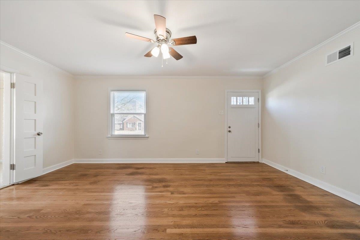 753 Ivy Road Memphis, TN 38117 - Photo 6 of 25 a view of an empty room with wooden floor