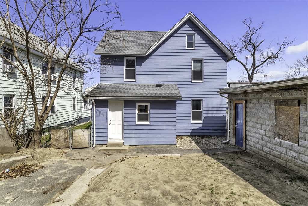 191 Hampden Street Springfield, MA 01151 - Photo 5 of 40 a front view of a house with a yard and garage