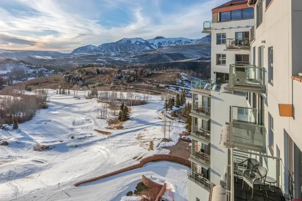a bathroom with a double vanity sink a mirror and a bathtub