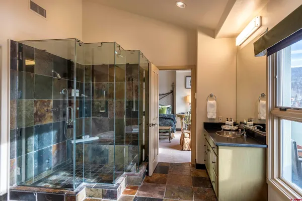 a bathroom with a sink double vanity and a mirror