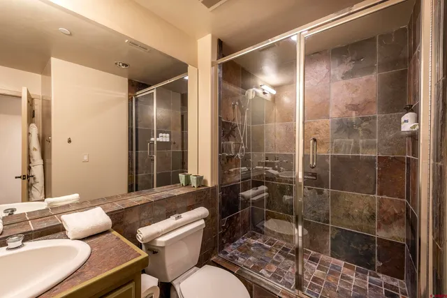 a bathroom with a sink double vanity and a mirror