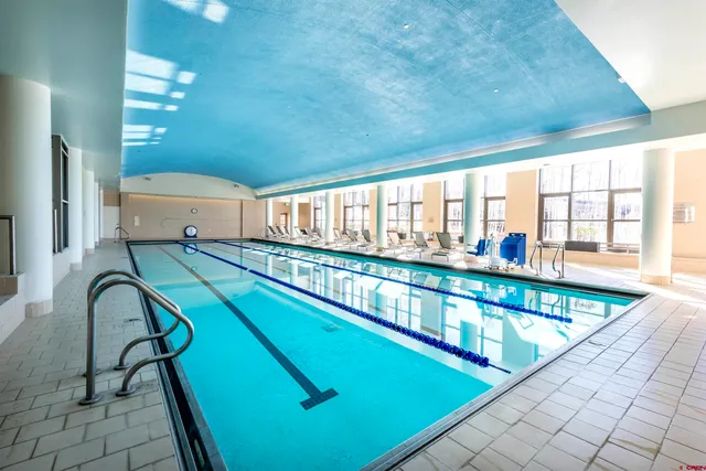 a view of a room with lots of gym equipment