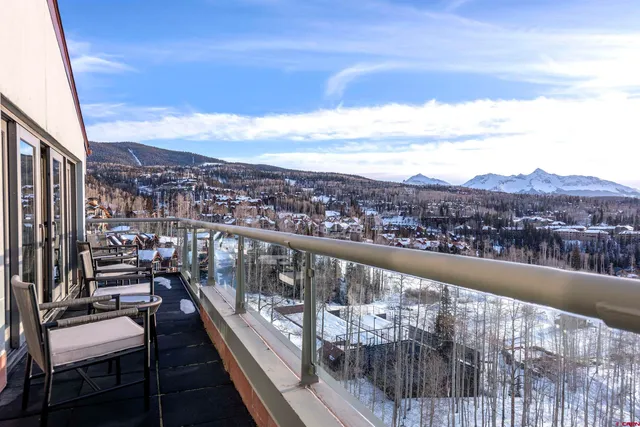 a view of a chairs and table on the terrace