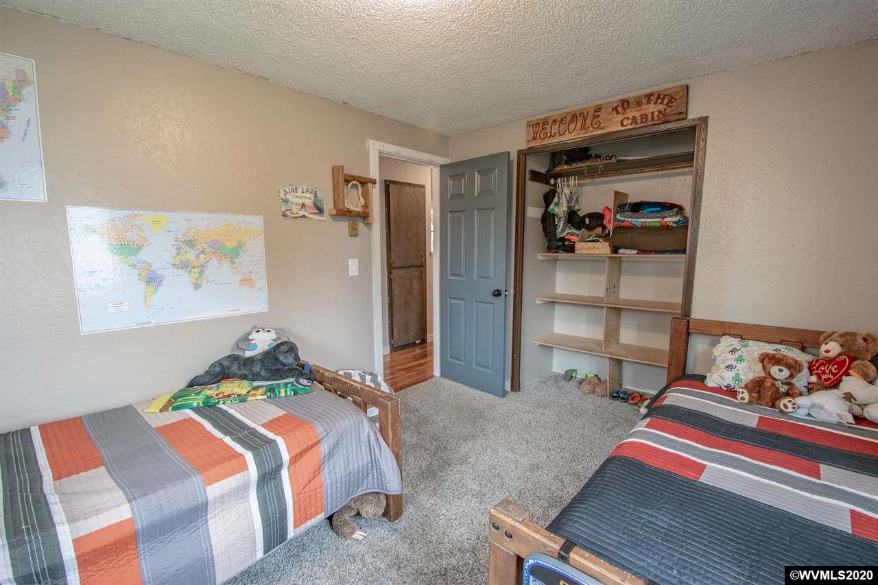 1955 Debra Drive Springfield, OR 97477 - Photo 18 of 27 a bedroom with a bed and closet