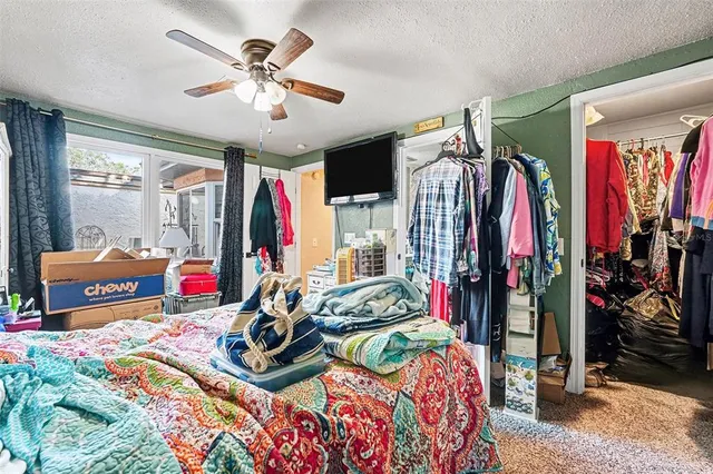 a bedroom with bed and window