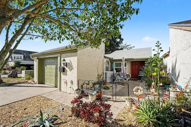 a front view of a house with sitting area