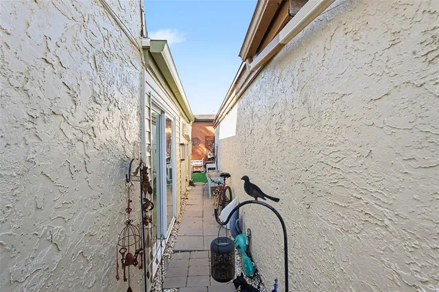 a view of backyard with outdoor seating and plants
