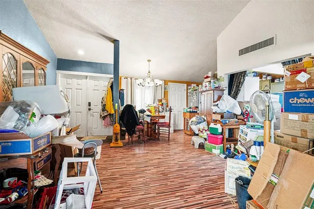 a view of a play room with furniture and toys