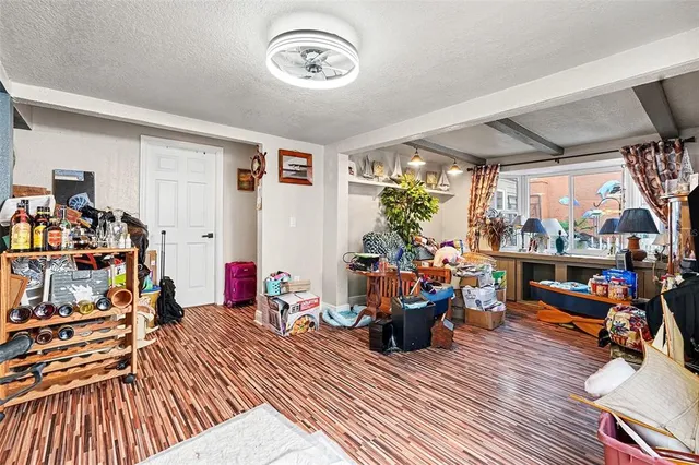 a view of a dining room with wooden floor