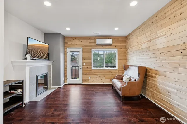 a living room with fireplace furniture and a flat screen tv