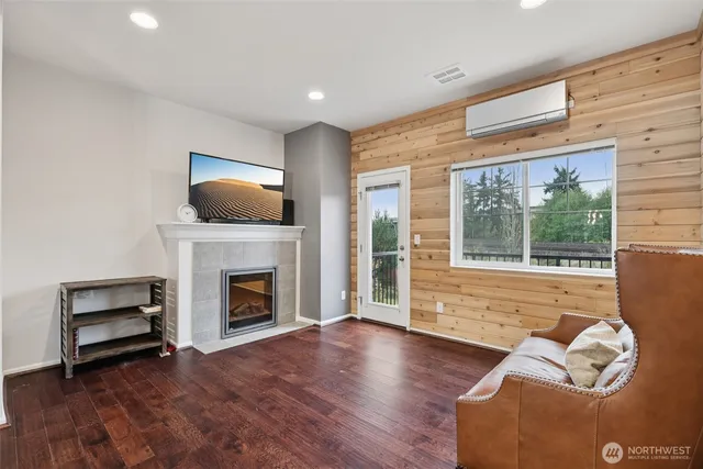 a living room with furniture fireplace and flat screen tv