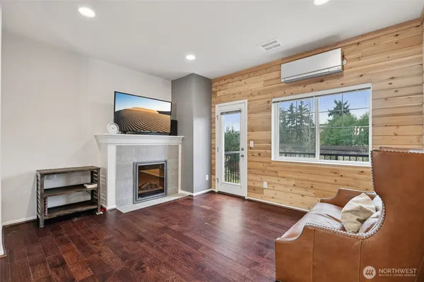 a living room with furniture fireplace and flat screen tv
