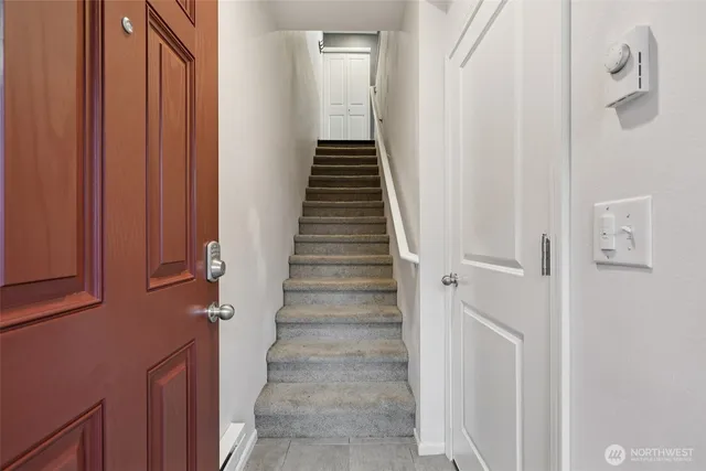 a view of a hallway with stairs
