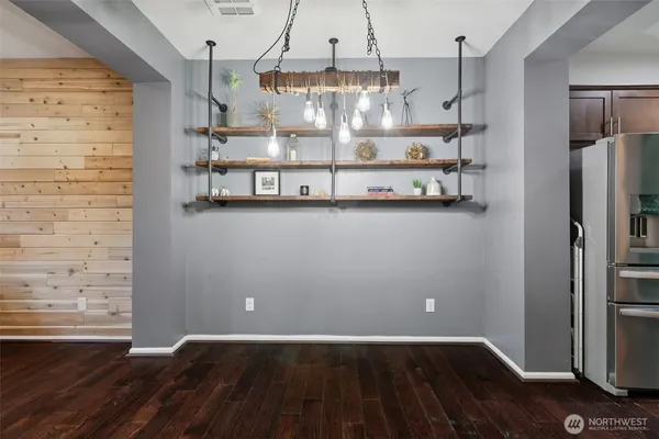a view of room with wooden floor