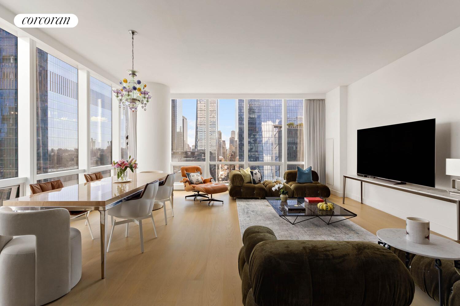 15 Hudson Yards, Unit 25H Manhattan, NY 10001 - Photo 2 of 16 a living room with furniture and a flat screen tv