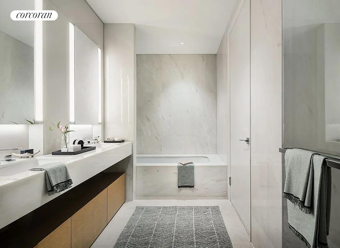 15 Hudson Yards, Unit 25H Manhattan, NY 10001 - Photo 9 of 16 a bathroom with a double vanity sink a toilet and a shower